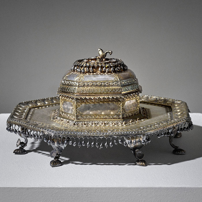 A parcel-gilt silver pandan on footed tray