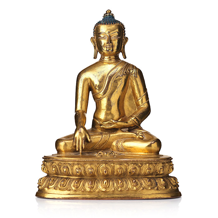 A gilt bronze figure of Akhsobya buddha, Tibet, 15th Century